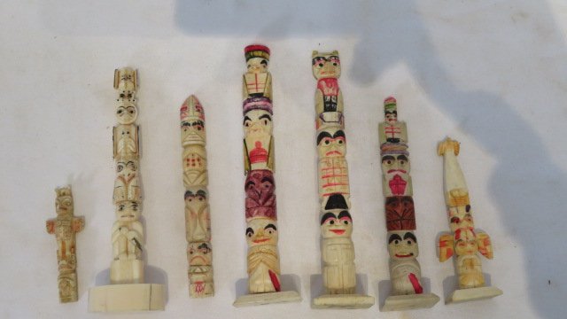 7 miniature walrus bone Eskimo art totem poles: 7 miniature walrus bone Eskimo art totem poles, largest is 5.25"T, Provenance the late Sally Siegrist