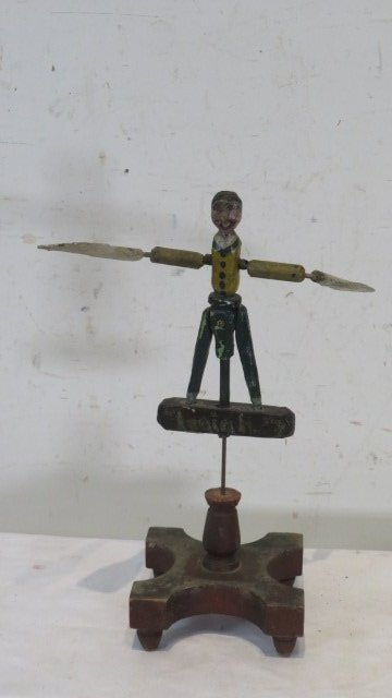 Folk art Whirligig "Isaiah": Folk art wood Whirligig of boy with name "Isaiah" hand painted on front, 13 1/2" base 5" x 5"