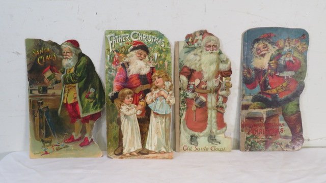 4 older Santa books: 4 older Santa books, one on left is made by McLoughlin Bros, next one is Raphael Tuck & Sons copyright 1896, next one is printed in Bavaria, and one on right is also a Raphael Tuck & Sons, all are 14"