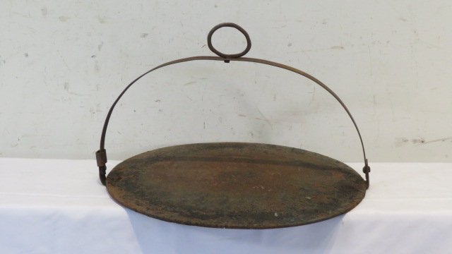Iron fireplace griddle: Iron fireplace griddle made to hang from a crane, 11"T x 17"D