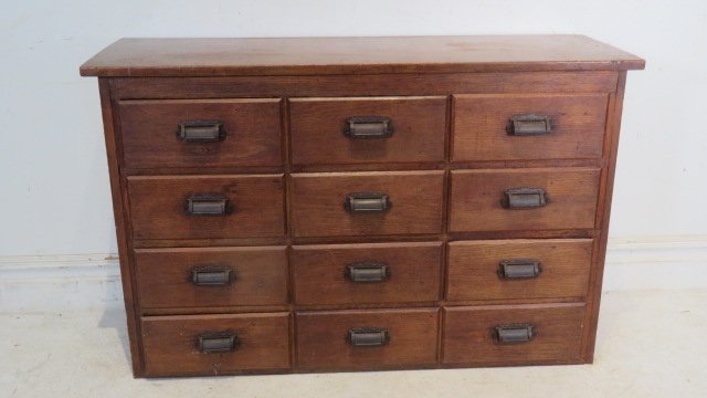 Late 19th-early 20th cen. pine and oak old store apothecary with original iron pulls: Late 19th-early 20th century pine and oak old store apothecary with original iron pulls, old natural surface, drawers are nailed, 31"T x 48"L x 16"D