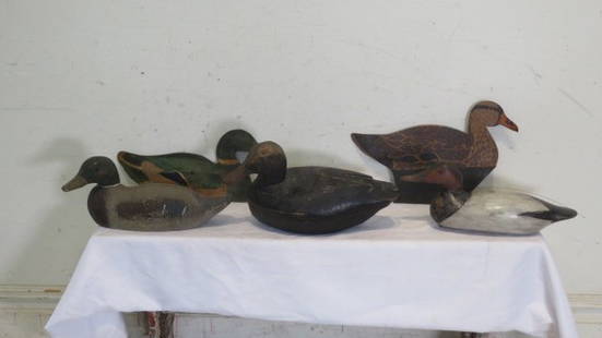 Group of 5 duck decoys: Group of 5 duck decoys, 3 wood and 2 cardboard: includes a Victor mallard drake, handmade black duck with carved wings 15"L x 9"T, factory redhead decoy with glass eyes (body has been repainted), and