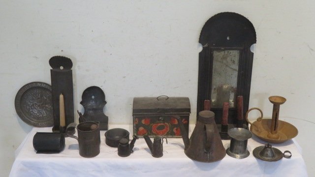 14 pcs of assorted tinware in a round splint basket: 14 pcs of assorted tinware including: an old single candle wall sconce, civil war shaving mug, 2 tin hanging match holders, toleware box, "Cock Robin" ABC plate, kerosene lamp filler, 2 little hanging