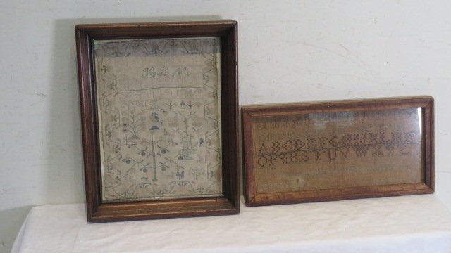 2 schoolgirl samplers in wood frames: 2 schoolgirl samplers in wood frames, neither are dated, largest is signed K.L.M. with apple tree, some dogs, etc. in period walnut frame 18"T x 15"W