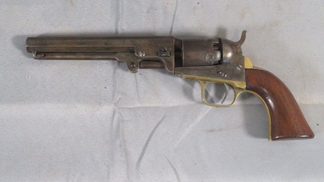 Colt 1849 36 cal. pocket model percussion revolver: Colt 1849 36 cal. pocket model percussion revolver, walnut grips, octagon barrel is 6"L, overall 11"L, matching serial numbers (187779)