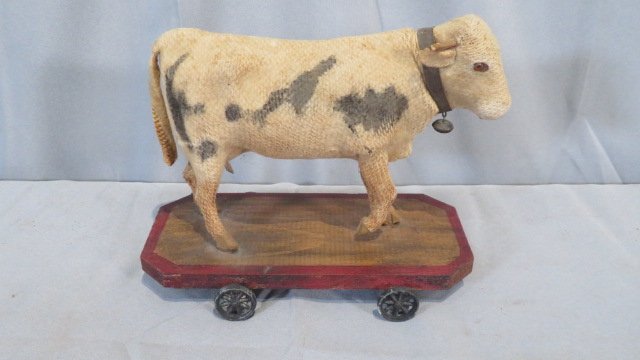 Felt covered toy cow on wheels (1 of 5)
