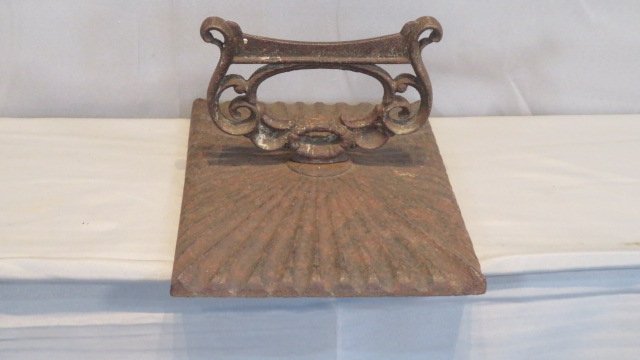 19th century cast iron boot scraper: 19th century cast iron boot scraper, sunburst design, 8"t. x 9 1/2' x 13"