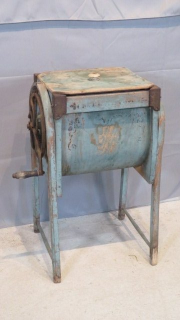 Wapakoneta, OH bent wood churn in old blue paint: Wapakoneta, OH bent wood churn, marked "The Bent Wood Churn, Made by The M. Brown Co., Wapakoneta, O" in old blue paint with black stenciling, 33"T x 24"W (including handle) x 15.5"D