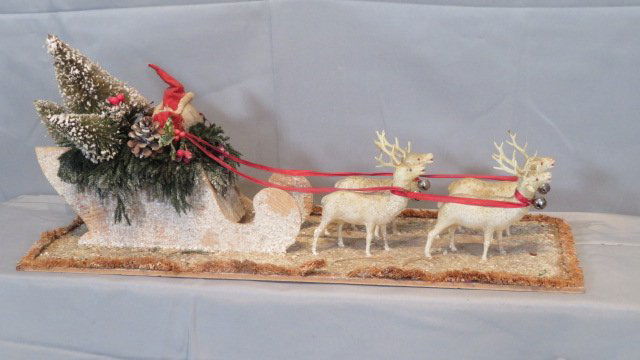 Vintage 27" long Santa and sleigh, cardboard and celluloid: Vintage Santa and sleigh, cardboard and celluloid, Santa has a papier-mache face and a felt suit, sleigh is carrying Christmas trees, 9.5"T x 27"L