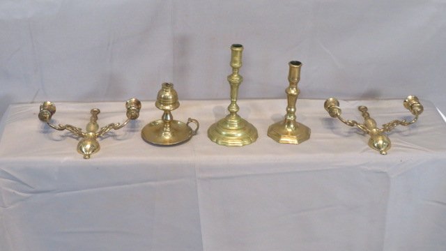 Group of 5 pcs of brass lighting: Group of 5 pcs of brass lighting, including: 2 reproduction wall sconces marked "Made in England", an early whale oil lamp, and 2 19th century candlesticks, tallest is 8.5"T