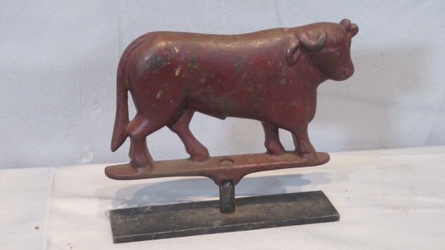 Cast iron bull in old red paint (1 of 2)