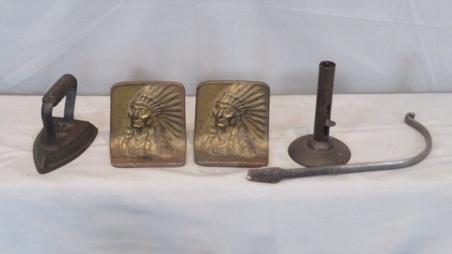 Group of 4 iron items, bookends, iron, candlestick, lifter (1 of 6)