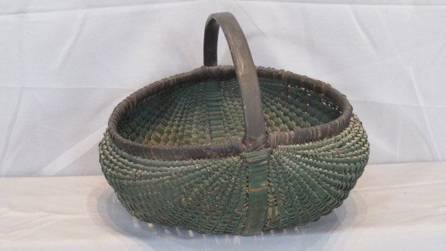 Painted buttocks basket in old green paint with black handle and rim (1 of 3)