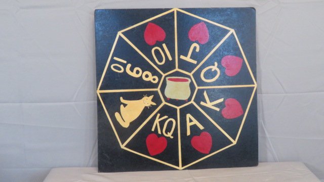 Mid-20th century gameboard painted on Masonite: Mid-20th century gameboard painted on Masonite with cat, hearts, and a pot in the middle, 26" square