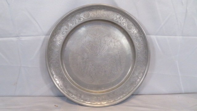 19th century 16" pewter charger with engraving: 19th century 16" pewter charger with engraving that includes Jesus, 2 Angels, and 12 Apostles, with portraits of the Apostles around the rim, touchmark on back