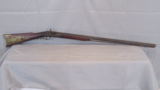 19th century cap and ball half stock rifle: 19th century cap and ball half stock rifle with a tiger maple stock in old surface and a patch box, barrel is signed Albany (NY), lock has some engraving with no marking, brass hardware, octagon barre