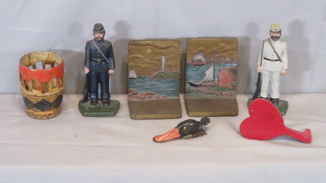 Group of cast iron items, bookends, duck head, heart (1 of 7)