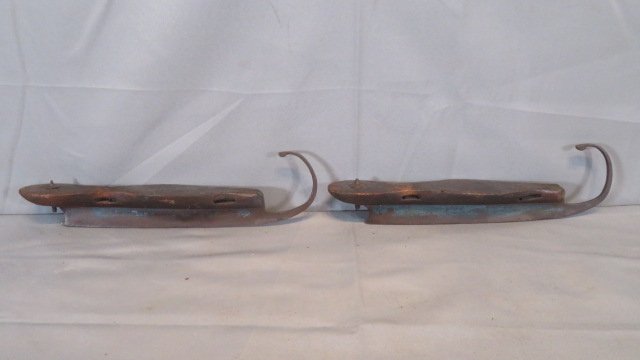 Pair of early cast steel and wood ice skates (1 of 4)