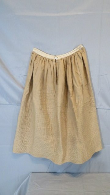 Early 19th century quilted tan petticoat: Early 19th century quilted tan petticoat 36"L x 32"W (across bottom)