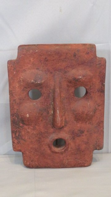 South American terra cotta wall hanging of mask (1 of 2)