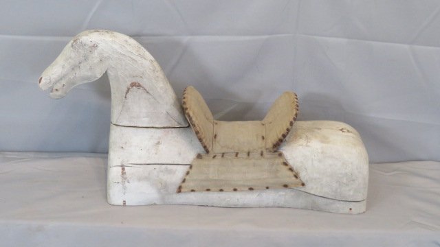 Part of a wood rocking horse with original saddle: Part of a wood rocking horse with original saddle in old white paint, 13"T x 26"L