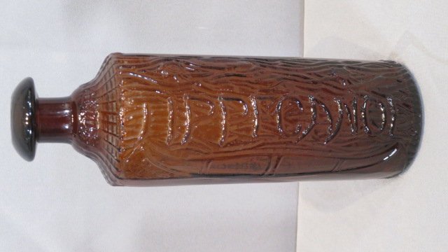 H.H. Warner & Co., Tippecanoe, bitters bottle: H.H. Warner & Co., Tippecanoe, bitters bottle, amber, marked Rochester, NY on the bottom, 9"T x 3"D