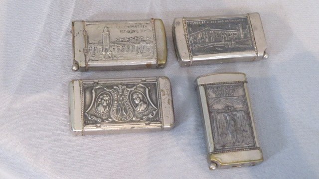 4 souvenir match safes, 1904 World's Fair and Pan-Am Exposition: 4 souvenir match safes, 3 are from the 1904 World's Fair in St. Louis, including one that has likeness of Thomas Jefferson and Napolean on one side with the Machinery Building on the opposite side, 2