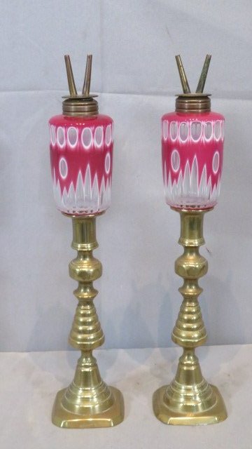 Pair of Sandwich Glass overlay whale oil peg lamps: Pair of Sandwich Glass pink and white overlay whale oil peg lamps with a pair of 19th century English brass beehive candlesticks, 15"t.