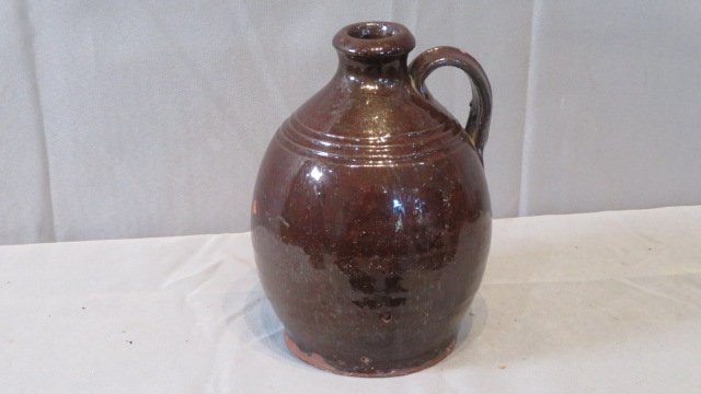 Early ovoid redware jug with manganese glaze (1 of 6)