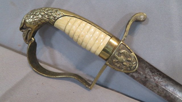 American War of 1812 Officer's sword: American War of 1812 Officer's sword with eagle pommel, flying eagle on hilt and initials C.H.S., some engraving on blade, bone grip, 35" long