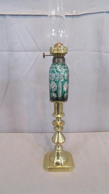 19th century green cut to clear Sandwich glass peg lamp: 19th century green cut to clear Sandwich glass peg lamp whale oil converted to kerosene on a 19th century 8" brass candlestick, 14" to top of burner