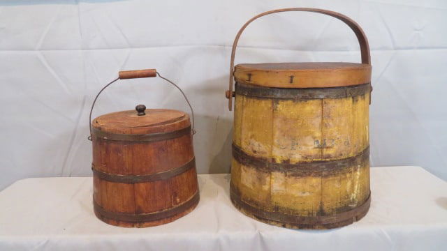 2 wood firkins: 2 wood firkins, the large one has traces of old yellow paint and traces of the "Mincemeat" paper label and wood handle 11"T x 10.5"D (at top) & 11.5"D (at bottom), the smaller one has a wire bale and