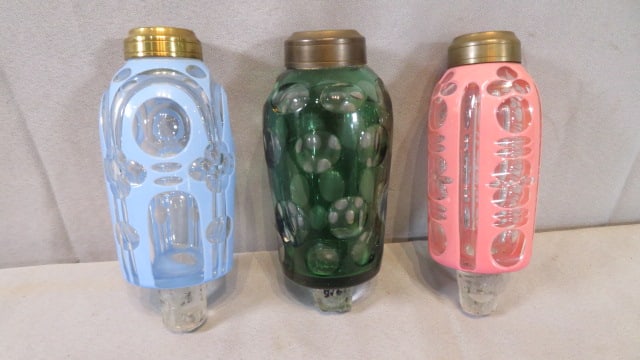 3 Sandwich glass peg lamps: 3 Sandwich glass peg lamps including one blue cut-to-clear, one green cut-to-clear, and a pink cut-to-clear, no burners, largest is 5.25"L