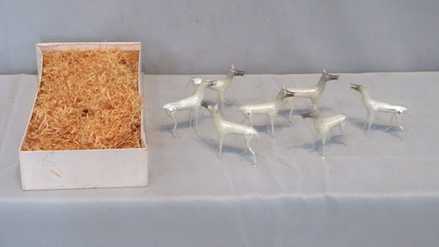 7 hand-blown glass Christmas deer: 7 hand-blown glass Christmas deer with bottom of original box and original price tag of $1, each one is marked "Made in Germany" with sticker on bottom, 3"T x 3"L, box is 5.5" x 9" x 2"deep