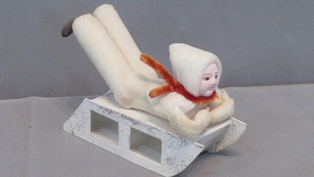 Vintage Christmas cotton batting child on cardboard sled (1 of 6)
