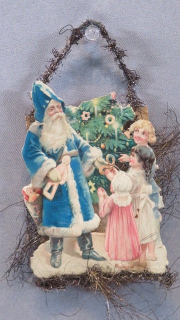 Dresden Christmas ornament with Santa and Children: Dresden Christmas ornament with Santa in blue suit and 3 children, tinsel, 6"