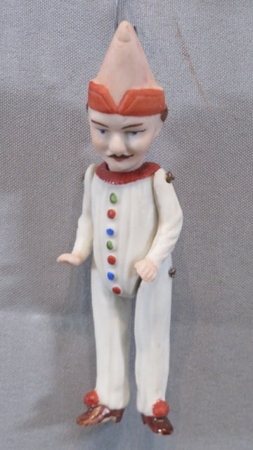 Bisque jointed Jester Christmas ornament: Bisque jointed Jester Christmas ornament, 4", wire hanger