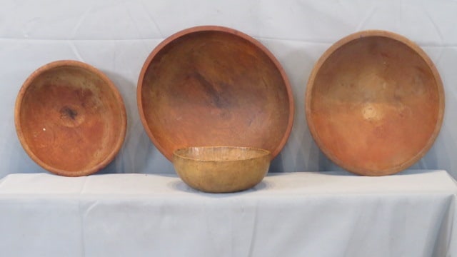 4 wood bowls in natural surface: 4 wooden bowls in old natural surface, largest is 15" dia. x 4" d., one on far right is marked Munising, smaller bowl is maple with some striping