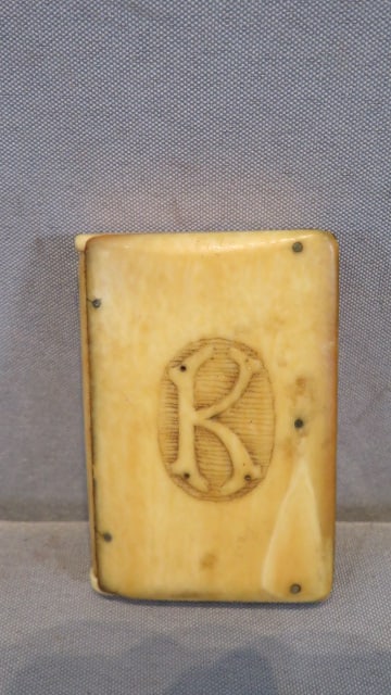 19th century bone match safe with an embossed "K": 19th century bone match safe with an embossed "K", both ends open, the striker is on the side, 2.5"T x 1.5"W x .5"D