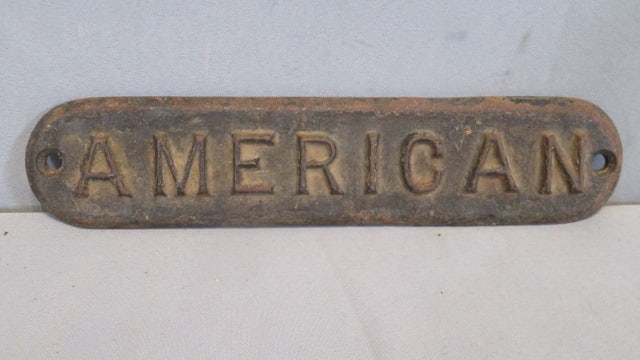Cast iron "American" sign (1 of 2)