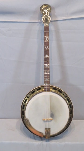Early pre-war Gibson 4-string banjo with maple with red stain resonator and neck: Early pre-war Gibson 4-string banjo with maple with red stain resonator and neck, mother of pearl inlays on fretboard and head, bone trim around resonator and neck, has Gibson label inside with 2 meta