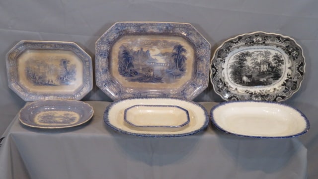7 - 19th century China platters: 7 - 19th century China platters, including 18" blue transfer Staffordshire, 2 other smaller blue transfer, a 15" black transfer of Paris Chateau scene, 3 creamware platters with a blue feather edge