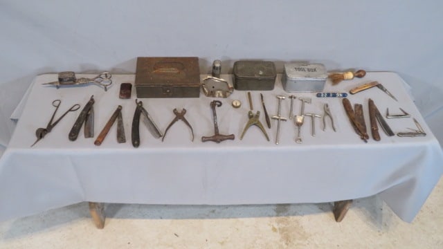 Group of small tools and related items: Group of small tools and related items, including a 7-pc set of nickel-plated iron miniature tools, 2 early bullet molds (one iron and one brass), early iron dental tooth puller, 2 lamp wick trimmers,
