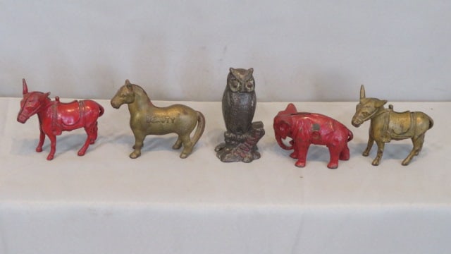 5 iron still banks: 5 iron still banks, including a 5" owl "Be Wise Save Money", an elephant with original Arcade sticker, a horse named "Judy", and 2 donkeys with saddles (one red and one gold)