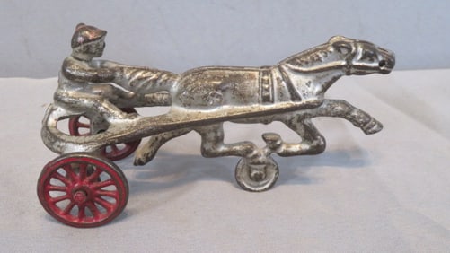 Late 19th century cast iron sulky with driver