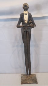Early 20th century cast iron and tin black butler cane stand