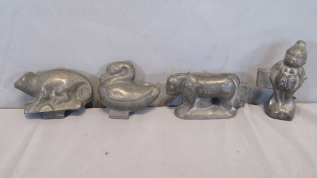 4 pewter ice cream molds in various animal shapes: 4 pewter ice cream molds in various animal shapes, including a possum marked 616, a swan marked 157, a steer marked S & Co and number 11, and a Circus monkey marked E & Co, NY and number 1031 5"T