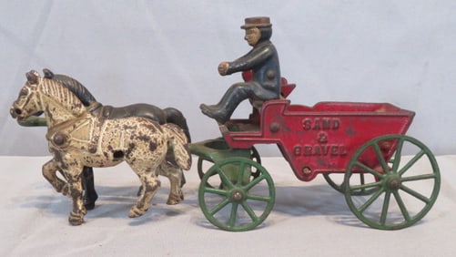 Cast iron horse-drawn sand and gravel wagon with driver
