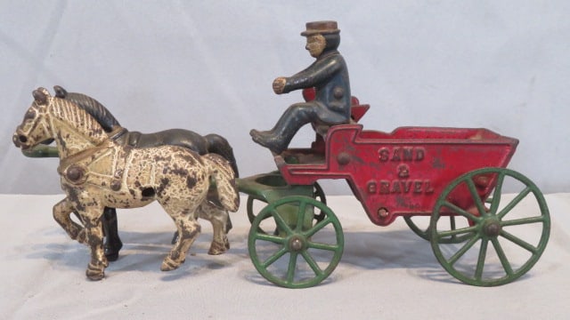 Cast iron horse-drawn sand and gravel wagon with driver: Cast iron horse-drawn sand and gravel wagon with driver, original paint, attributed to The Kenton Toy Co., Kenton, OH, 10"L
