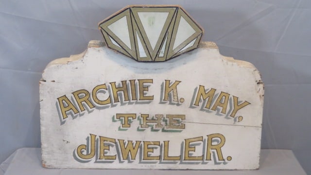 Wood Archie K. May Jeweler trade sign: Wood trade sign for Archie K. May The Jeweler with diamond depiction at top, 23"t. x 30" x 4", made hollow might have been mounted on a post, marked lower center B.L. Bahn